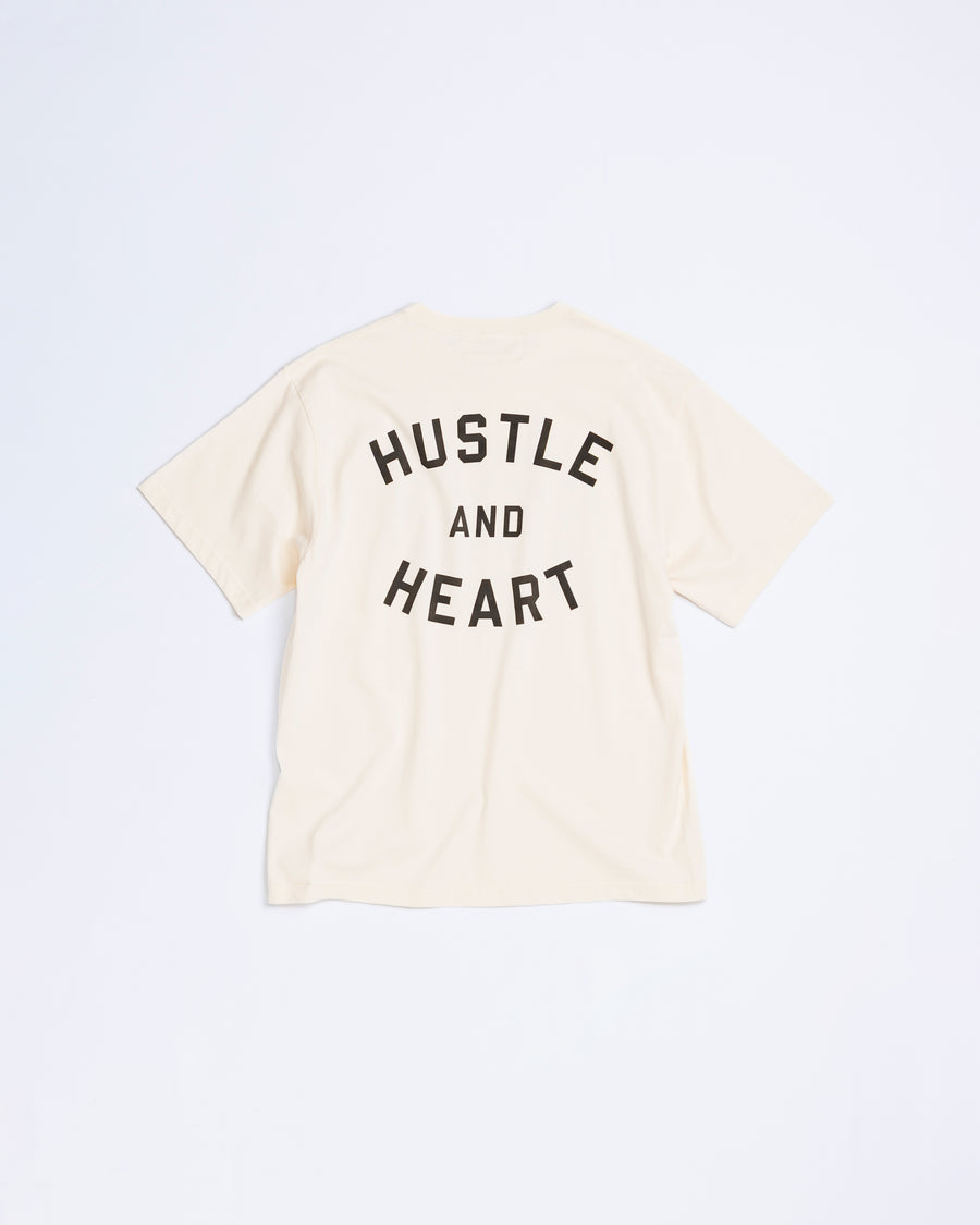 ANACHRONORM × Souvenyr NYC フェイシズ 半袖Tシャツ ベージュ | コラボグラフィック ニューヨーク コットン100%
